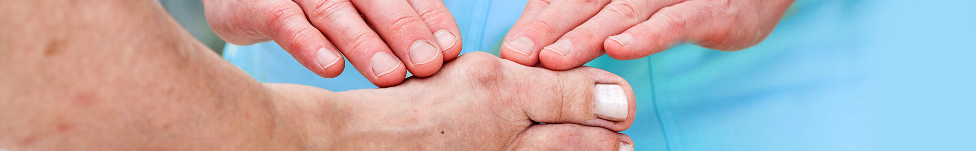 Image of doctors hands examining foot